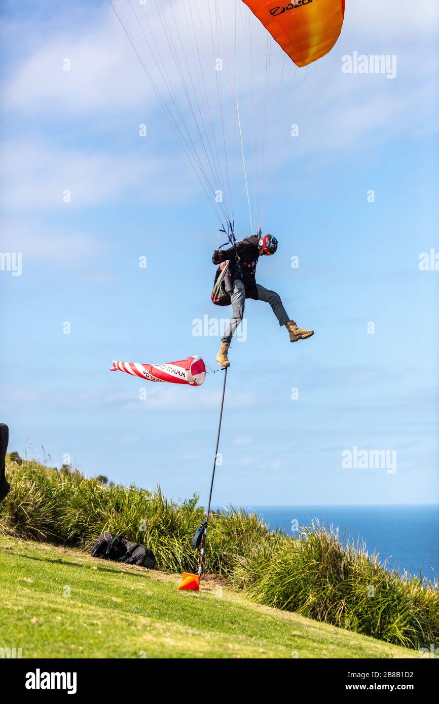 Paraglider balancing act on windsock Stock Photo