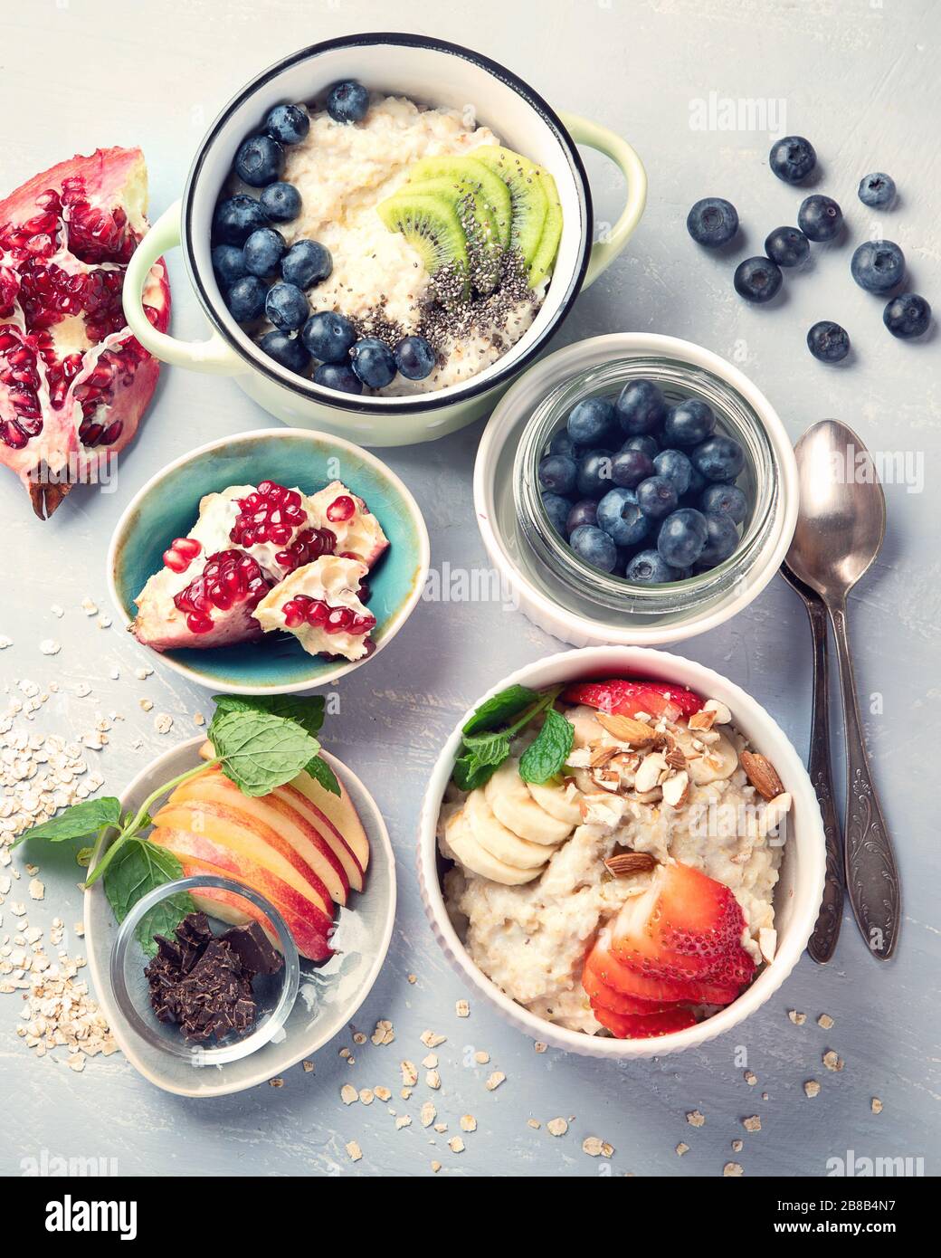 Bowls of oatmeal with berries and fruits for healthy breakfast. Food ...