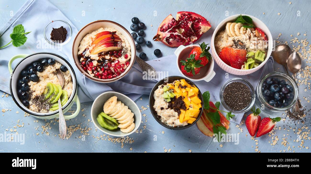 Bowls of oatmeal with berries and fruits for healthy breakfast. Food