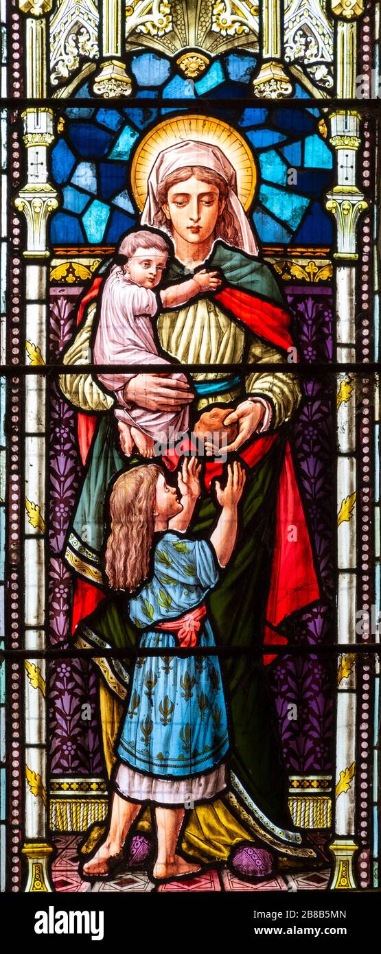 Stained glass window depicting Caritas or Charity, Bedingfield church