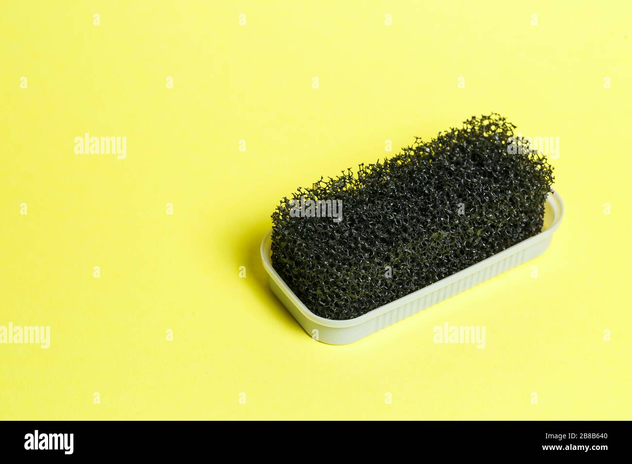 black nubuck suede brush with hard bristles Stock Photo