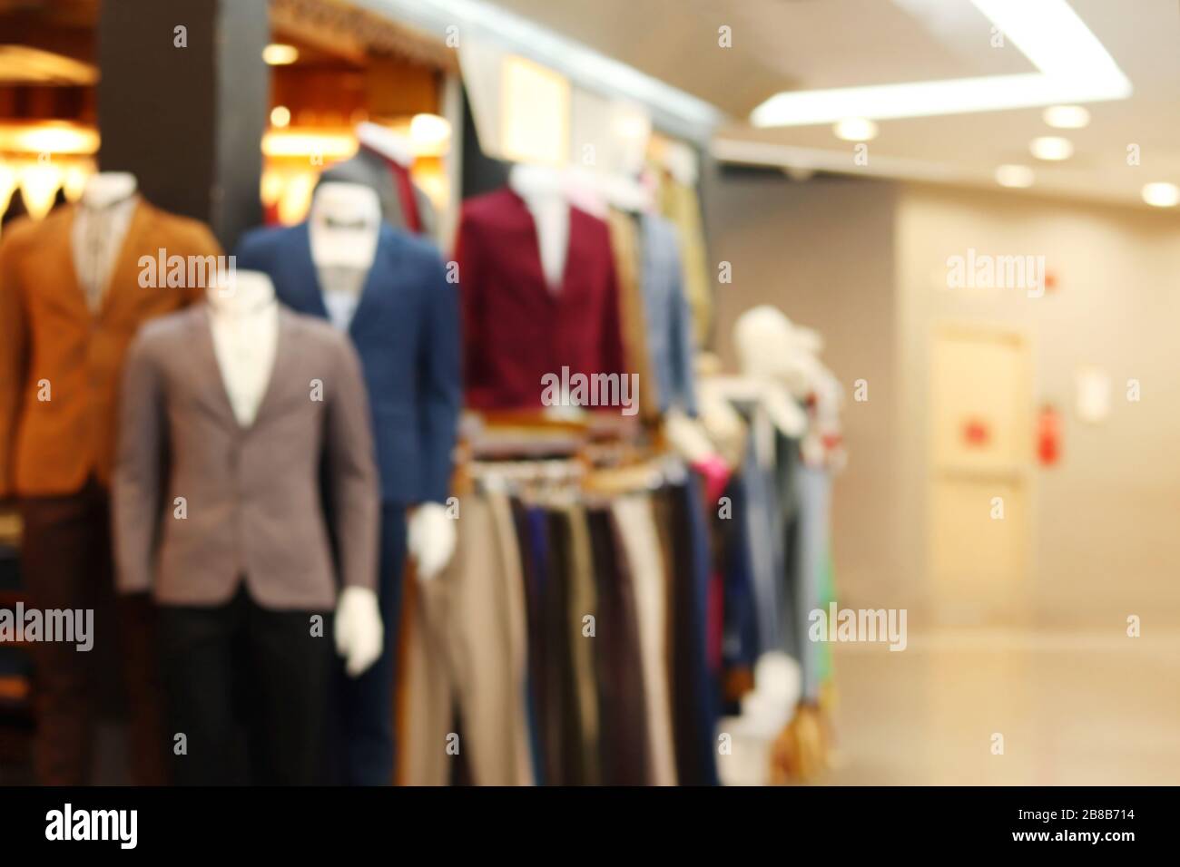 Blurred picture of Men Suit Shop Clothing store fashion shop inside shopping mall, Men Suit Shop background blur Stock Photo