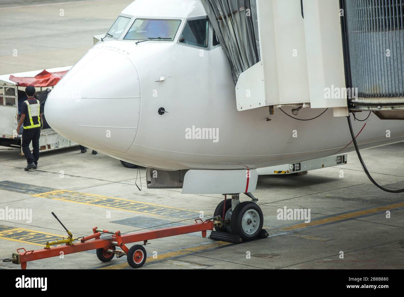 Close up on a white jetliner. Passenger plane at the airport. Suspended flights due to coronavirus outbreak. Stock Photo