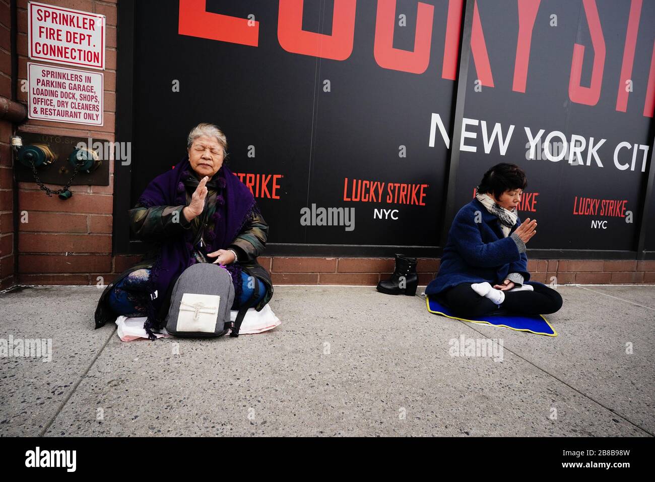 New York, USA. 20th Mar, 2020. Chine religious Falun Gong practitioner protest outside the Chinese Consluate building, Friday, March 20, 2020, in New York in the wake of the coronavirus COVID-19 pandemic. Credit: European Sports Photographic Agency/Alamy Live News Stock Photo