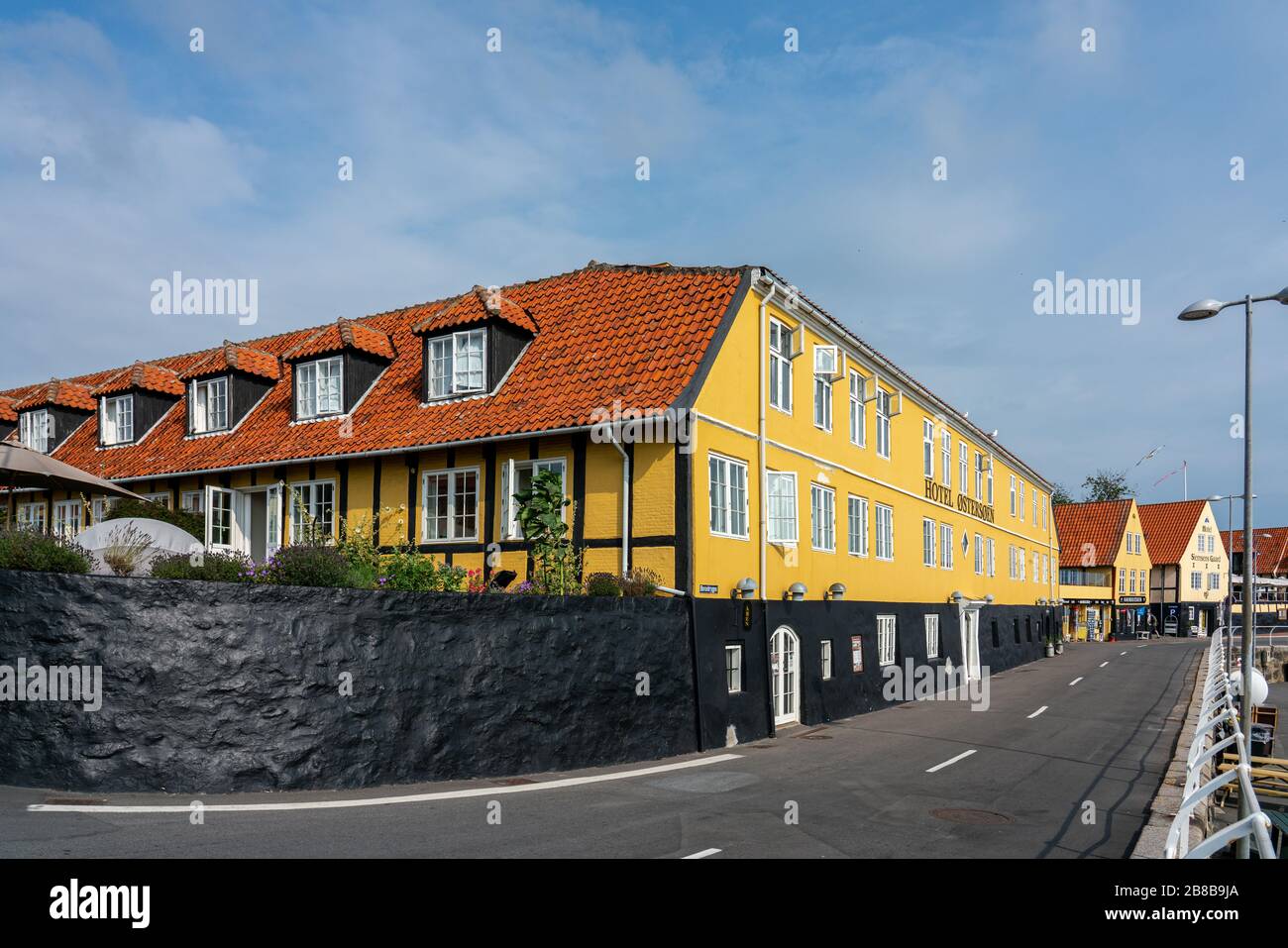 Svaneke, Bornholm / Denmark - July 29 2019: Hotel Ostersoen facade on a empty street in Svaneke in the Summer Stock Photo