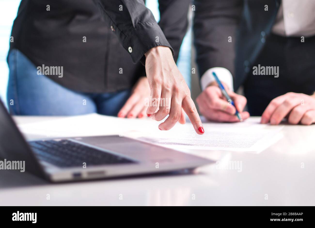 Business people having discussion. Professional woman and man working together in office. Consultant and advisor giving instructions. Stock Photo