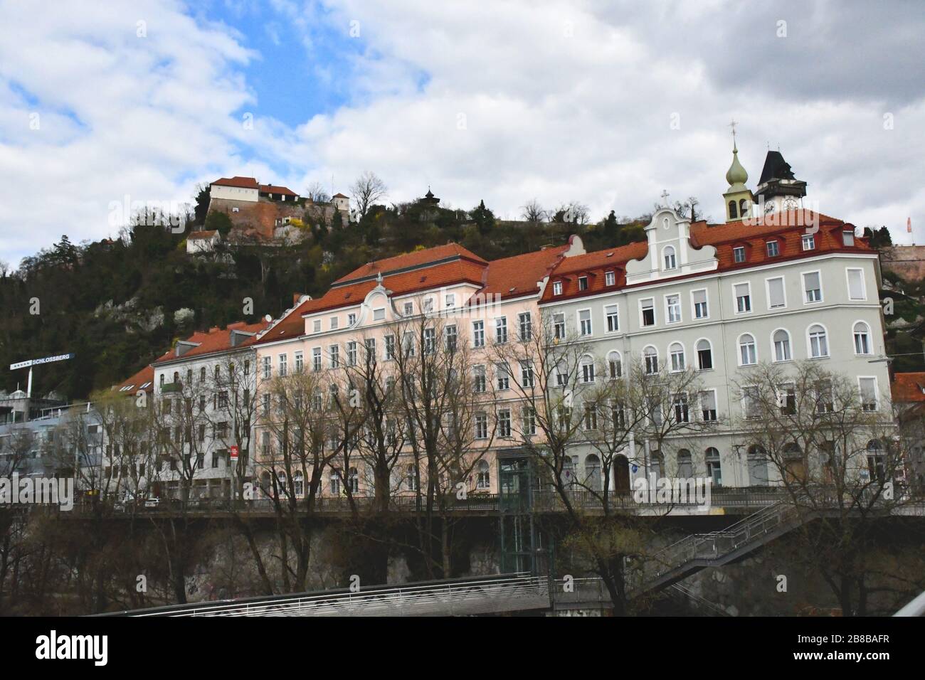 Facade of buildings along the river Mur in Graz, Austria Stock Photo