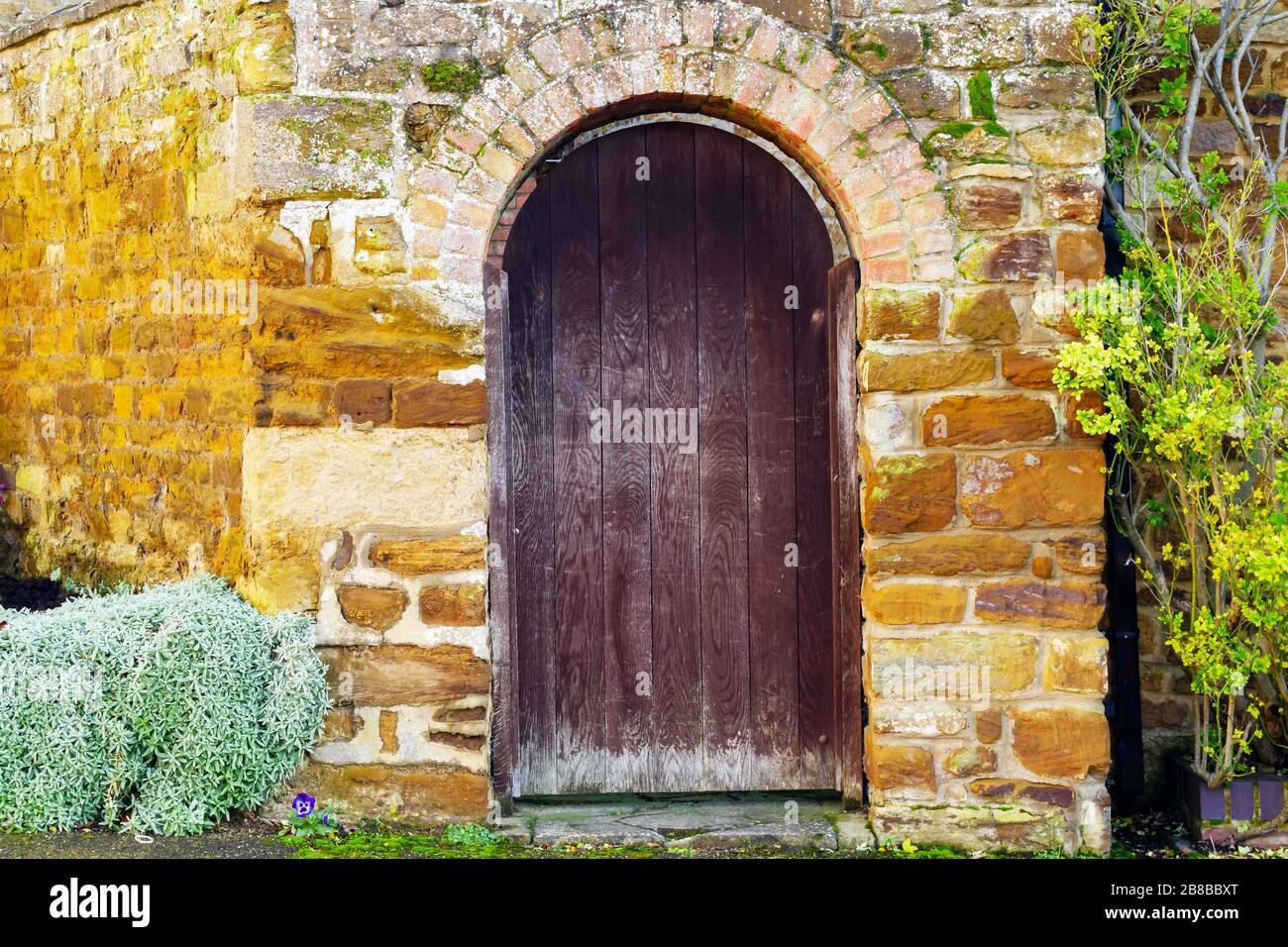 old door stone wall building texture in england uk Stock Photo - Alamy