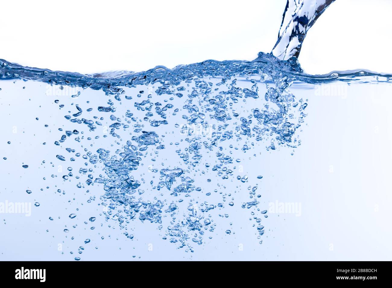 On white background which is filled with water, water is pouring and many  bubbles rise from bottom to top Stock Photo - Alamy