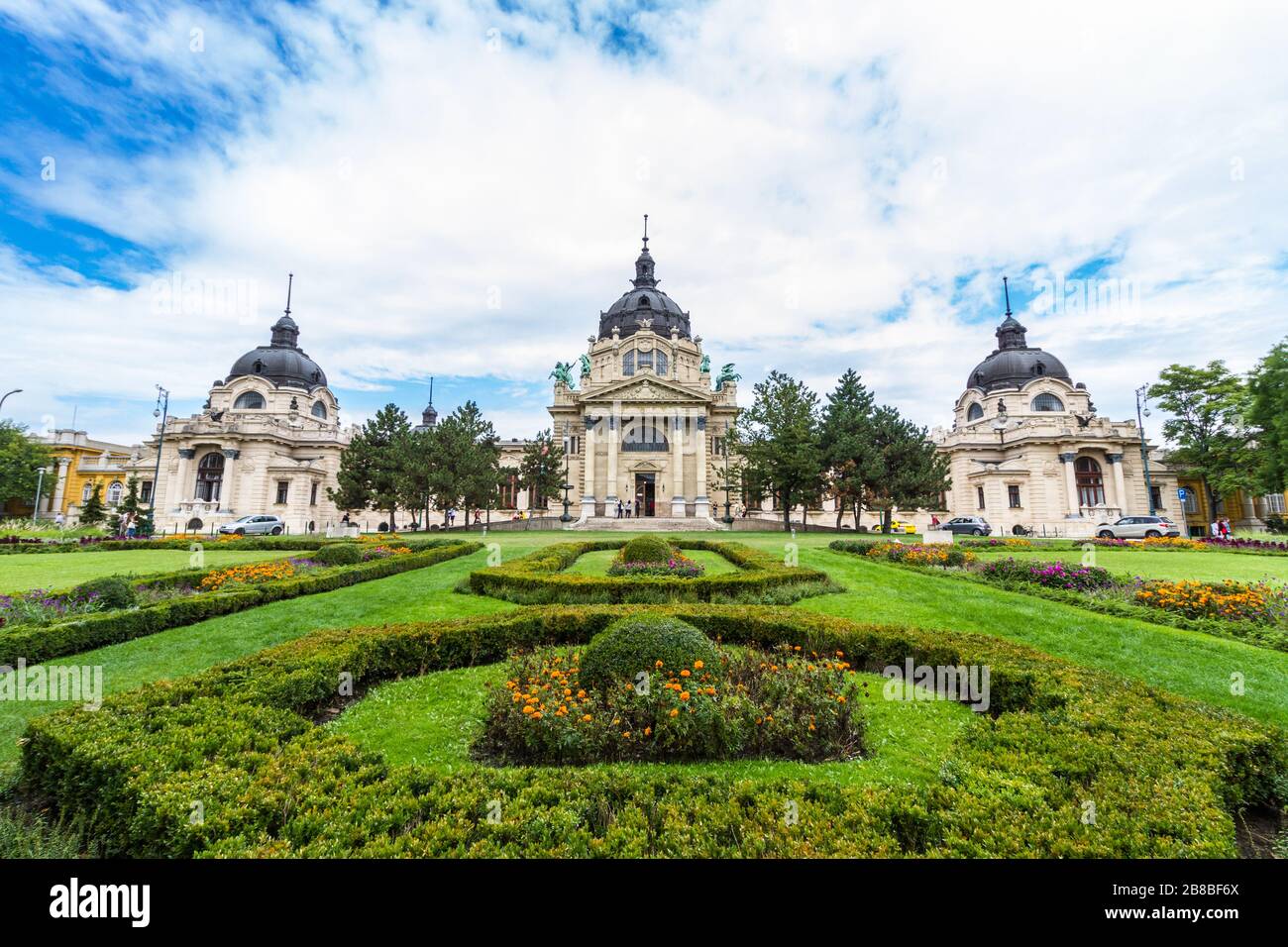 Facade of Szechenyi thermal bath building and formal gardens in City Park, Budapest, Hungary, landscape, wide angle Stock Photo