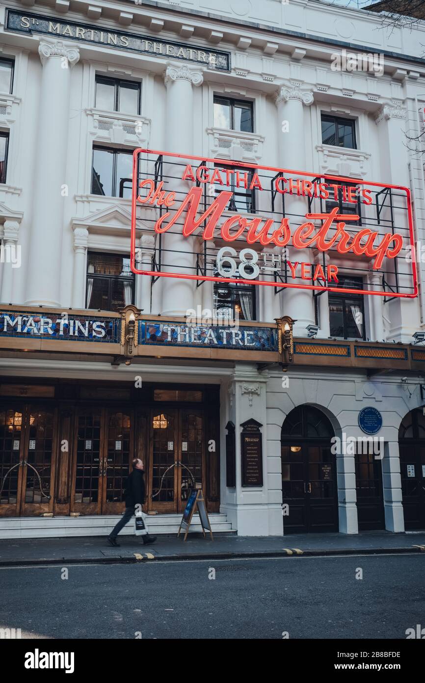 London, UK - March 06, 2020: Man walking past Mousetrap neon sign on ...