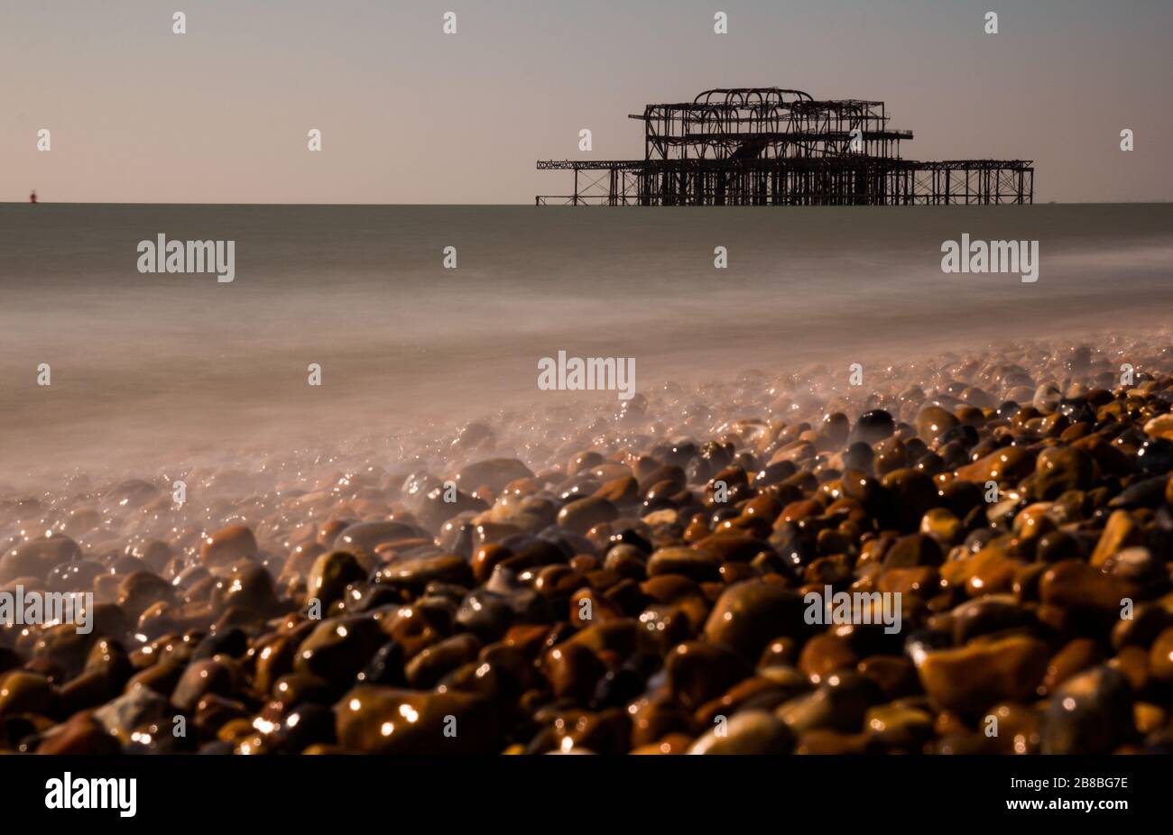 Old Brighton West Pier Burnt (Brighton Palace Pier) on Coastal beach Stock Photo