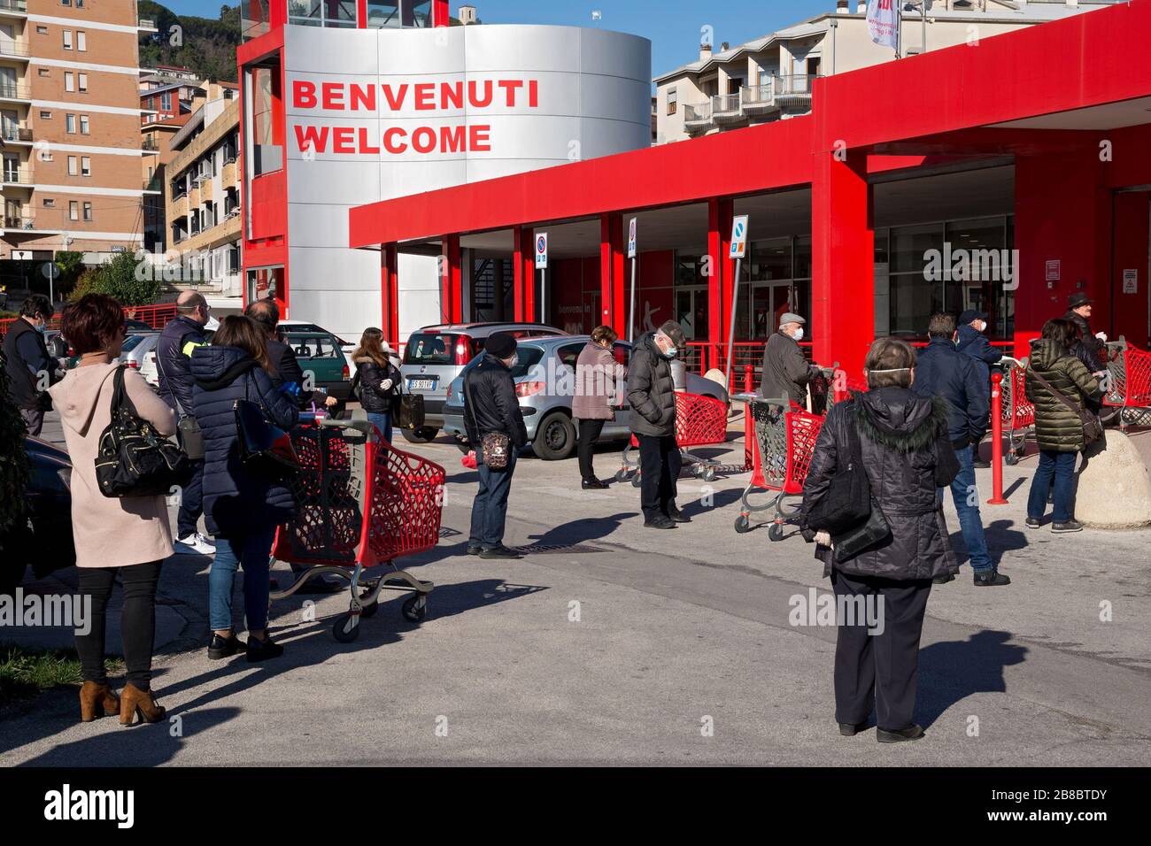 Campobasso,Molise Region,Italy:People keep their safety distance by waiting in line to enter the supermarket during the coronavirus emergency in Campo Stock Photo