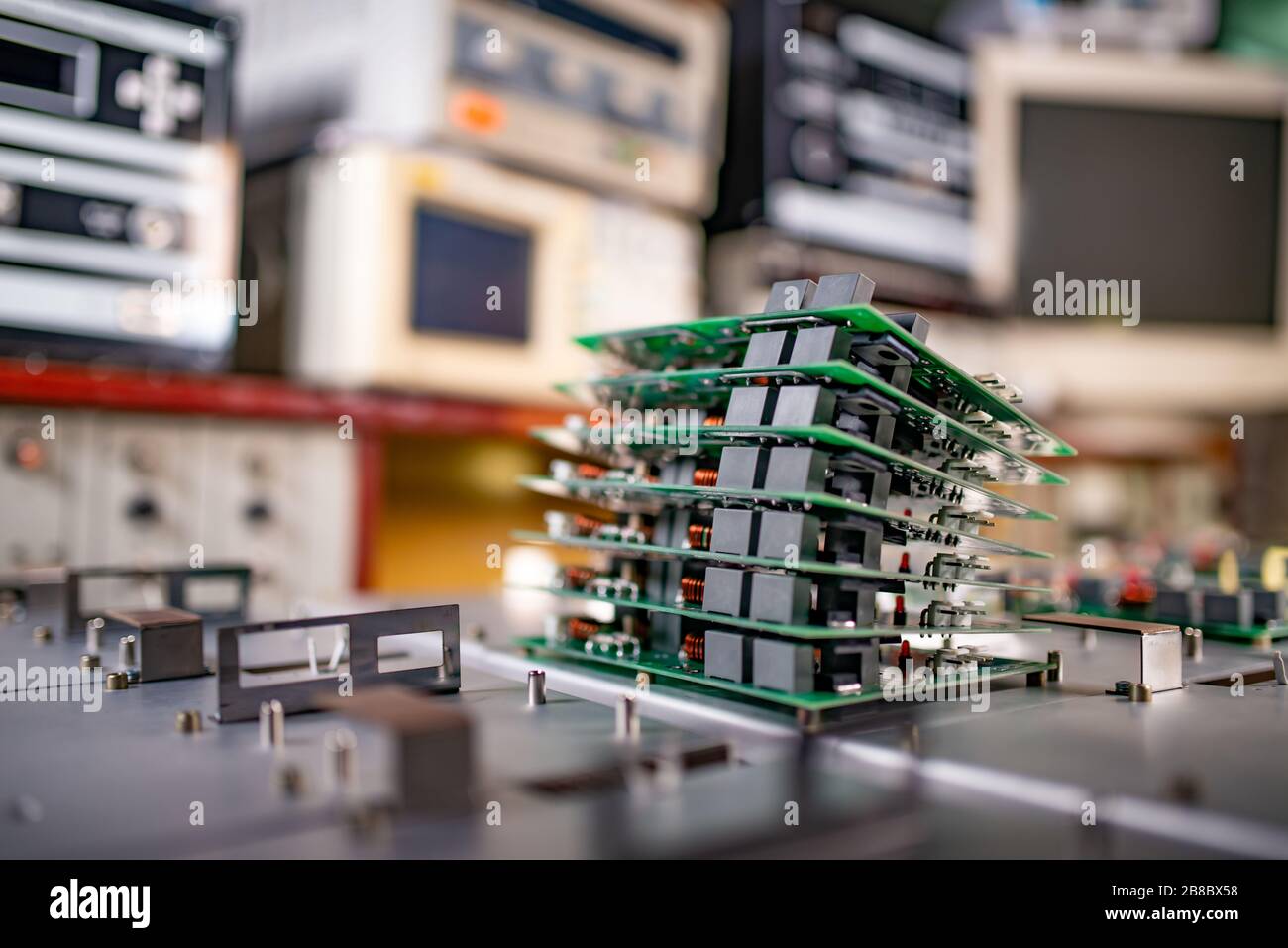 Microchips are stacked on top of each other on metal plates in the