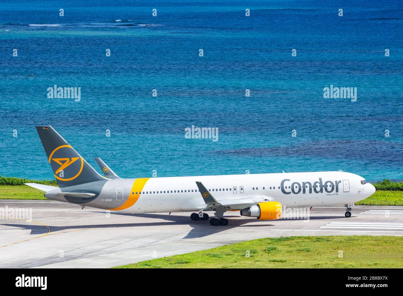 Mahe, Seychelles – February 8, 2020: Condor Boeing 767-300ER airplane at Mahe airport (SEZ) in the Seychelles. Boeing is an American aircraft manufact Stock Photo