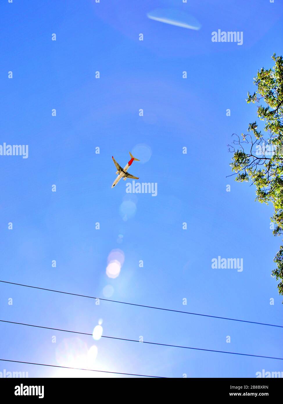cloudy sky with jet plane Stock Photo