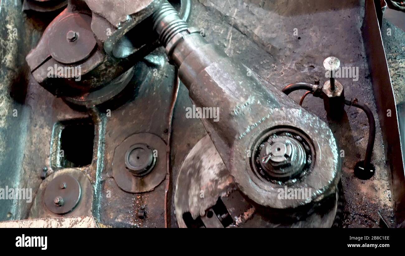 Moving gears of a vintage machine driven by steam engine Stock Photo