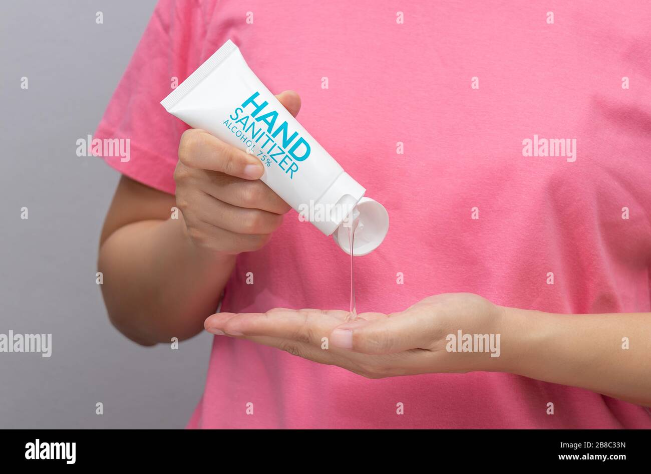 personal hygiene. people washing hand by hand sanitizer alcohol gel for cleaning and disinfection, prevention of spreading of germs during infections Stock Photo