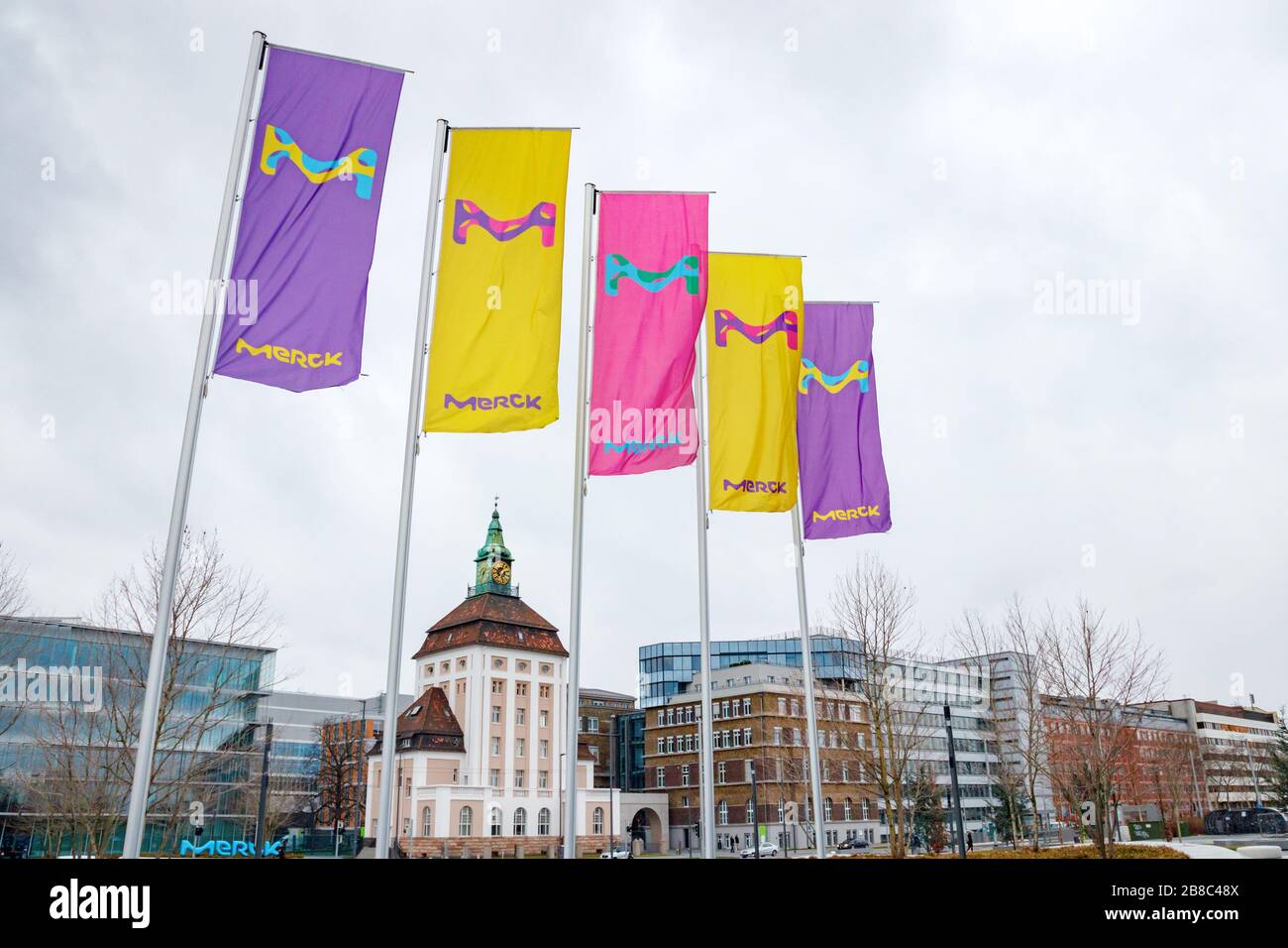 Line of flags with the Merck logo. Merck KGaA is one of the largest pharmaceutical companies in the world. Darmstadt, Germany. Stock Photo