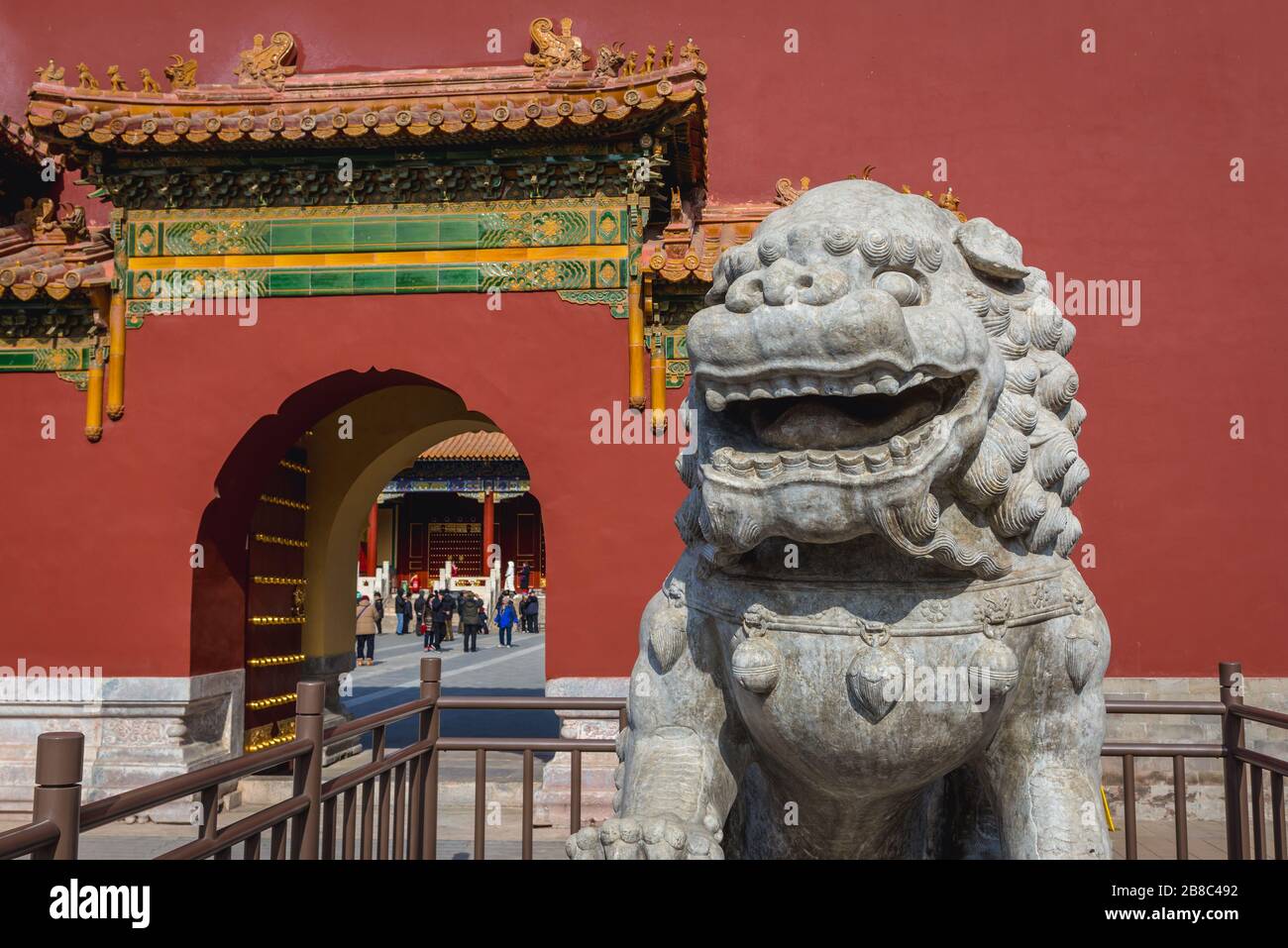 Guardian lion statue in front of entrace to Shouhuang - Palace of Imperial Longevity in Jingshan Park in Beijing, China Stock Photo