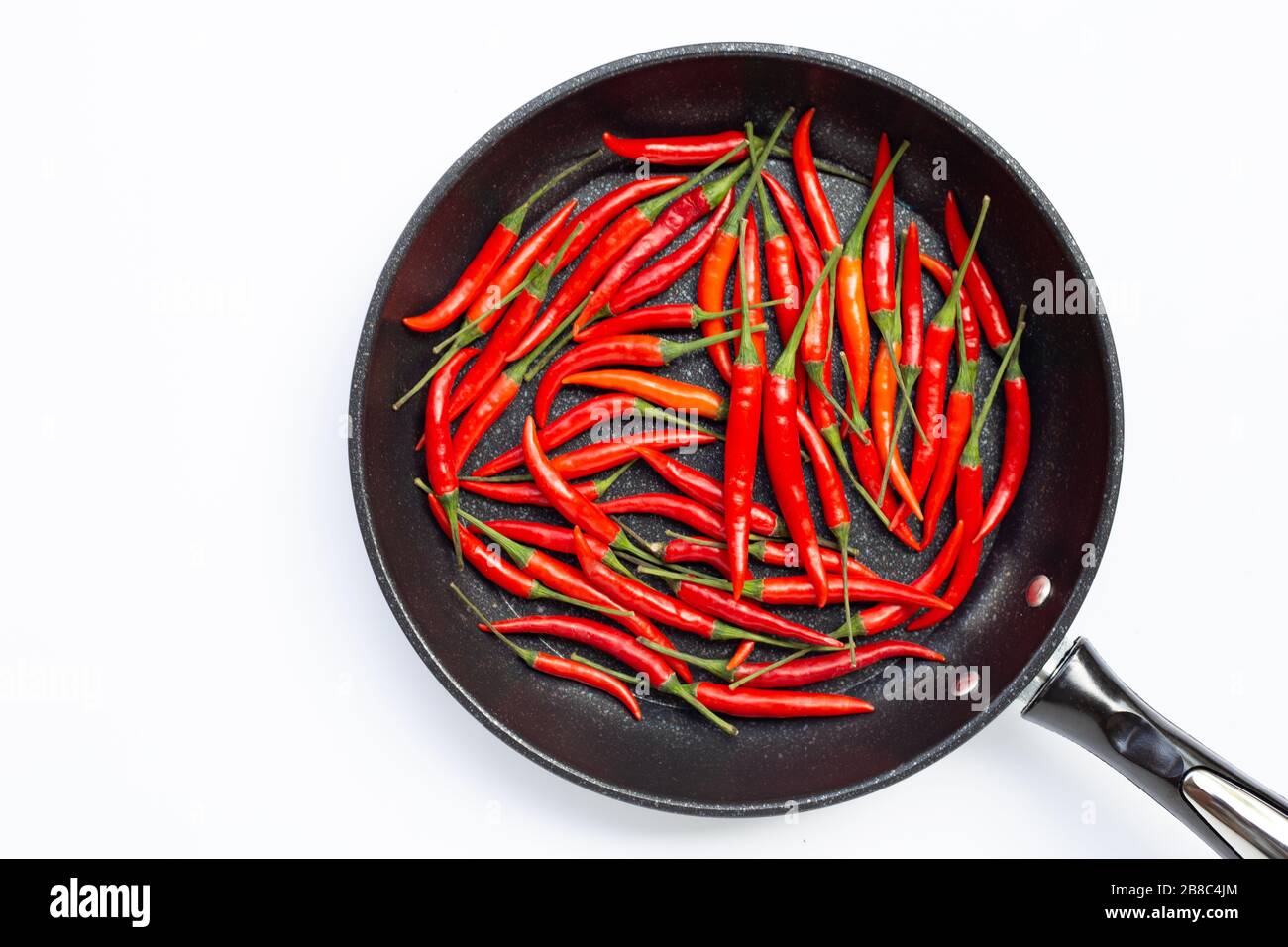 https://c8.alamy.com/comp/2B8C4JM/hot-chili-peppers-in-a-pan-on-white-background-top-view-2B8C4JM.jpg