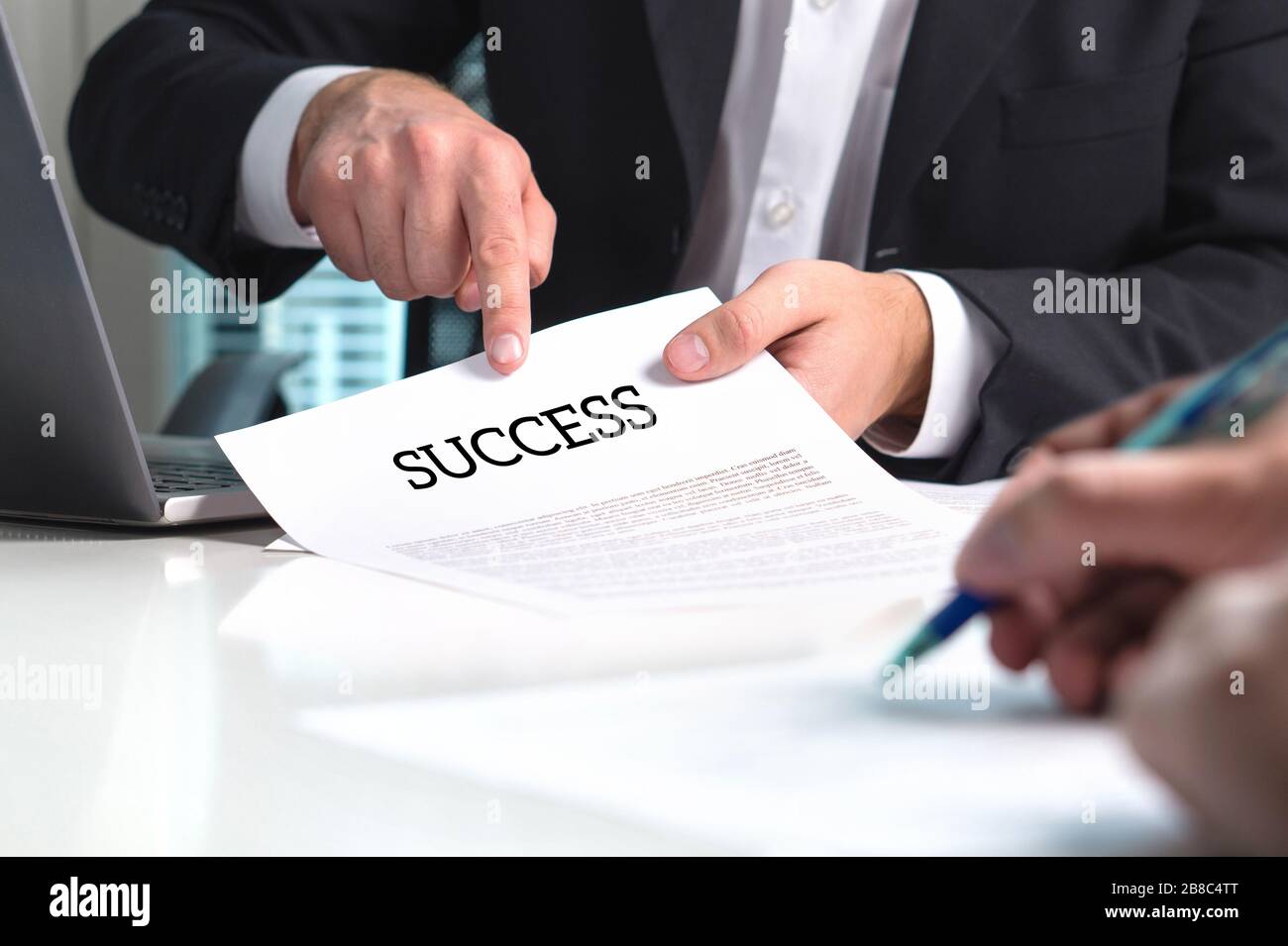 Strategy to success. Professional business man and management consultant giving advice to entrepreneur with new company. Advisor, mentor or teacher. Stock Photo
