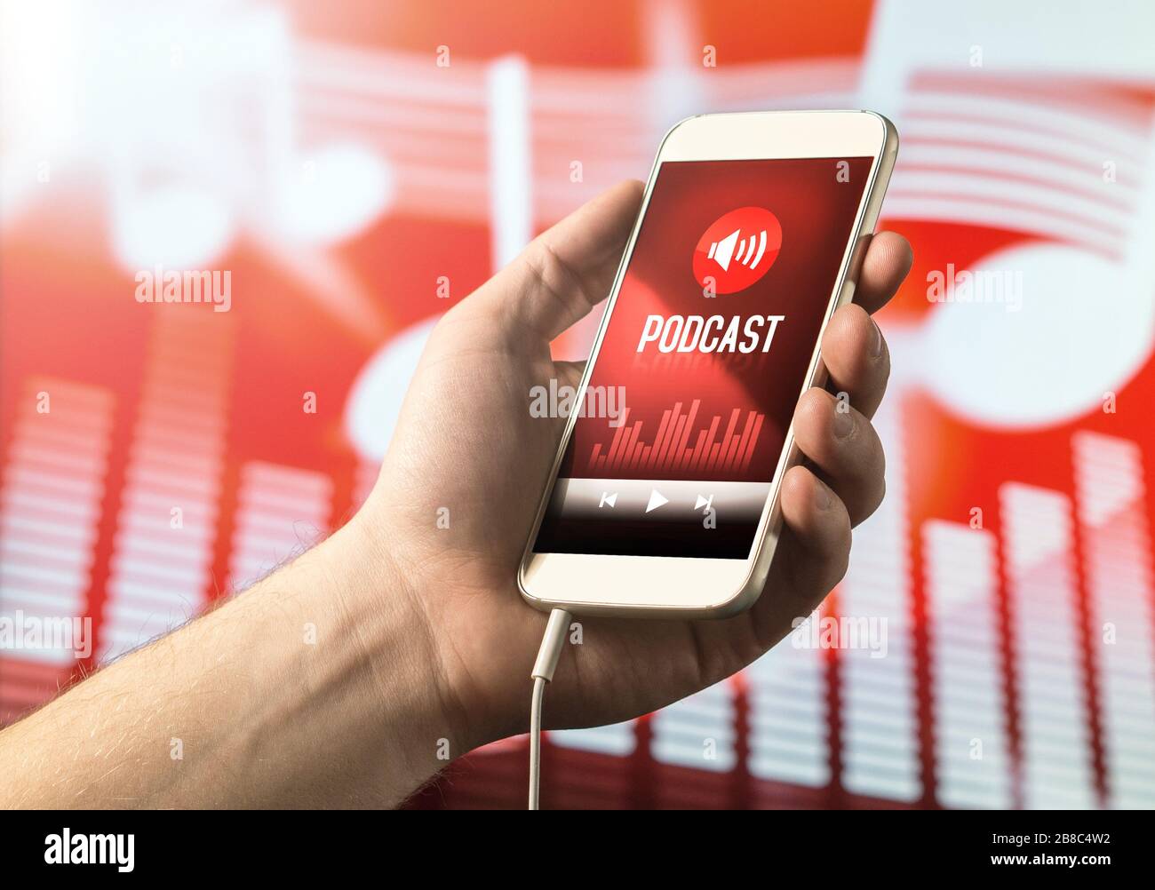 Hand holding smartphone with podcast app on screen. Mobile phone with application on abstract background. Stock Photo