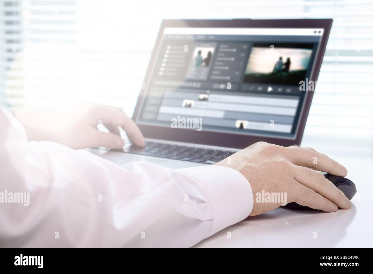 Video editing with laptop. Professional editor working in creative studio office. Stock Photo