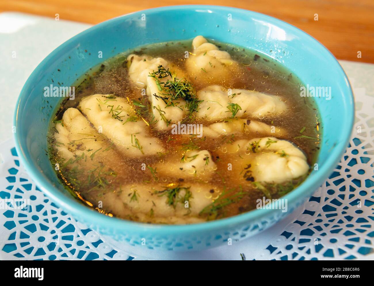 Kolduny, small stuffed dumplings filled with meat and boiled in broth - traditional dish in Poland and other Slavic countries Stock Photo