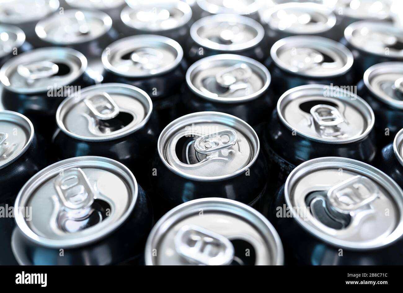 Many empty cans. A lot of opened soda, soft drink, lemonade, cola, beer or energy drink containers. Recycling, addiction or alcoholism concept. Stock Photo