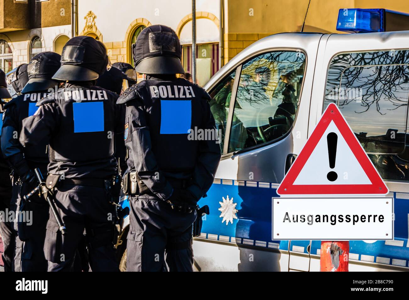 Police curfew warning sign in german Stock Photo