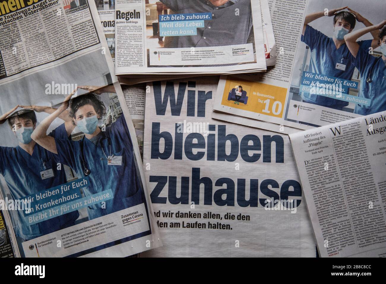 Berlin, Germany. 21st Mar, 2020. ILLUSTRATION: Newspapers with ...
