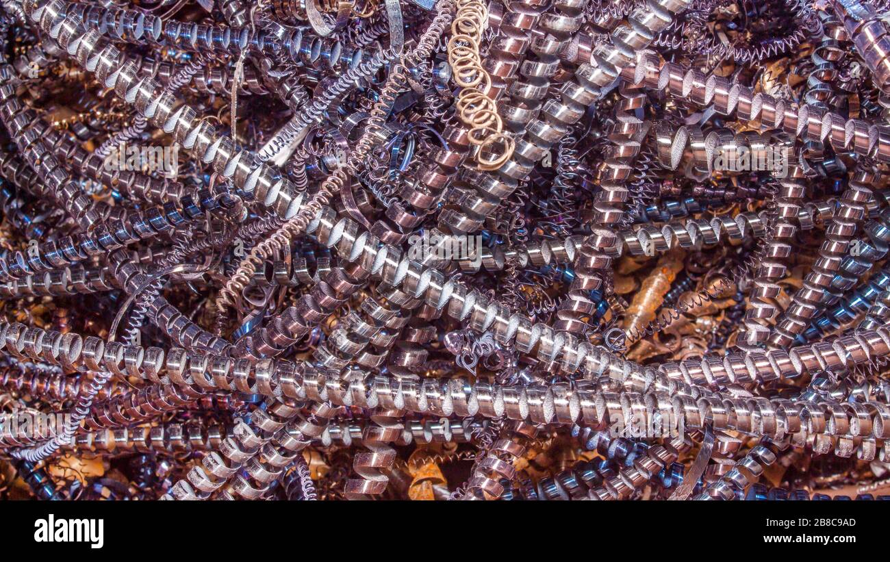 Abstract color background of metal shavings. Processing of ferrous and ...