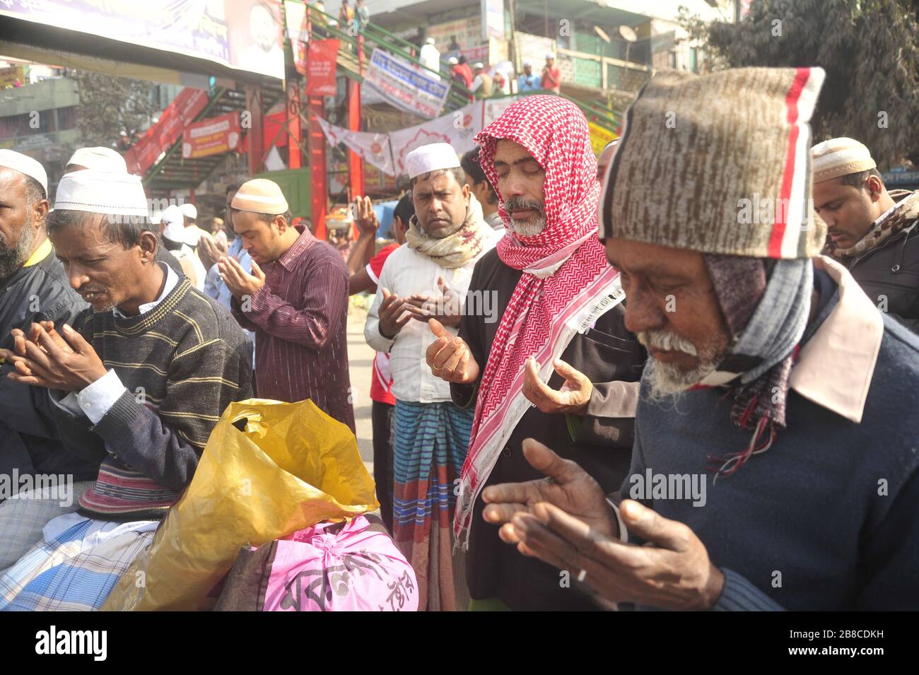 Devotees from home and abroad joined the 'Akheri Monajat 'of Biswa Ijtema, a function of Tablig Jamaat on the Turag bank in Tongi to seek divine bless Stock Photo