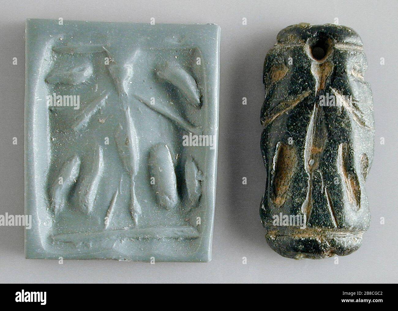 'Cylinder Seal; Iran, Mesopotamia or Syria, Transitional period, about 2900-2800 B.C.  Tools and Equipment; seals Black serpentine Height:  1 9/16 in. (3.9 cm); Diameter:  13/16 in. (2 cm) Gift of Nasli M. Heeramaneck (M.76.174.334) Art of the Ancient Near East; between circa 2900 and circa 2800 date QS:P571,+2500-00-00T00:00:00Z/6,P1319,+2900-00-00T00:00:00Z/9,P1326,+2800-00-00T00:00:00Z/9,P1480,Q5727902 B.C.; ' Stock Photo