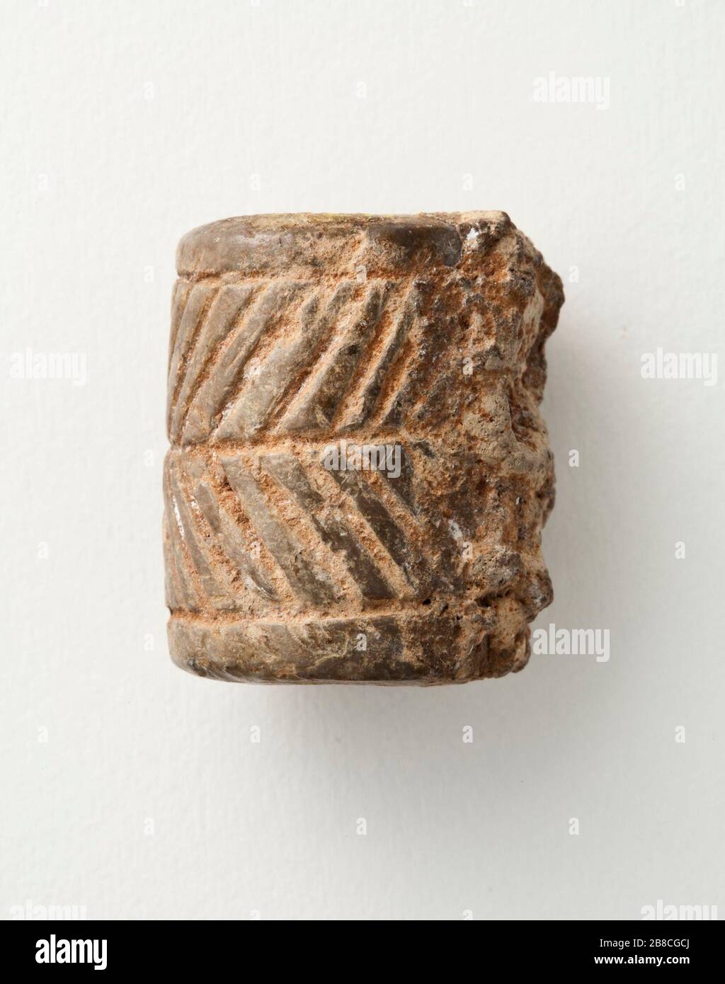 'Cylinder Seal; Iran, Mesopotamia or Syria, Transitional period, about 2900-2800 B.C.  Tools and Equipment; seals Brown serpentine Height:  1 in. (2.5 cm); Diameter:  11/16 in. (1.7 cm) Gift of Nasli M. Heeramaneck (M.76.174.329) Art of the Ancient Near East; between circa 2900 and circa 2800 date QS:P571,+2500-00-00T00:00:00Z/6,P1319,+2900-00-00T00:00:00Z/9,P1326,+2800-00-00T00:00:00Z/9,P1480,Q5727902 B.C.; ' Stock Photo
