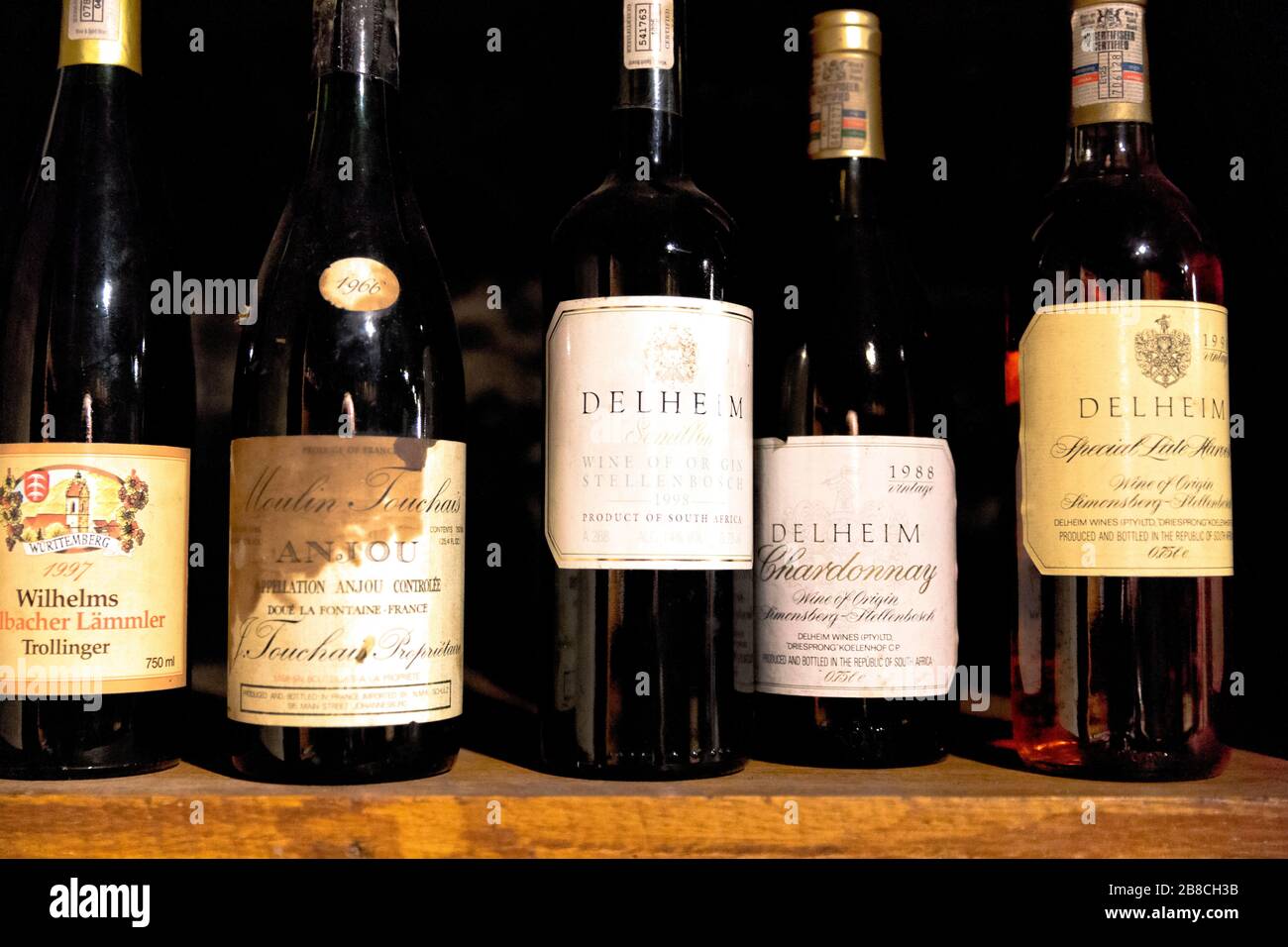 A row of rare vintage bottles of wine on display at the Delheim wine estate in Stellenbosch, South Africa Stock Photo