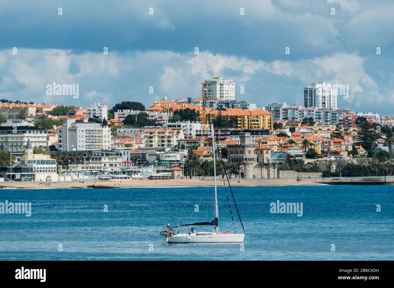 Pleasure vessel in Cascais Bay with Estoril in background, Portugal. Stock Photo