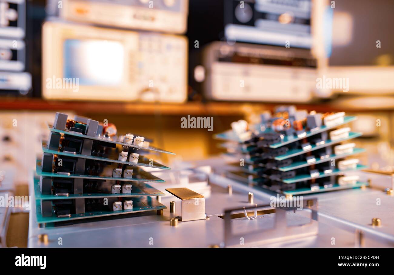 Microchips are stacked on top of each other on metal plates in the