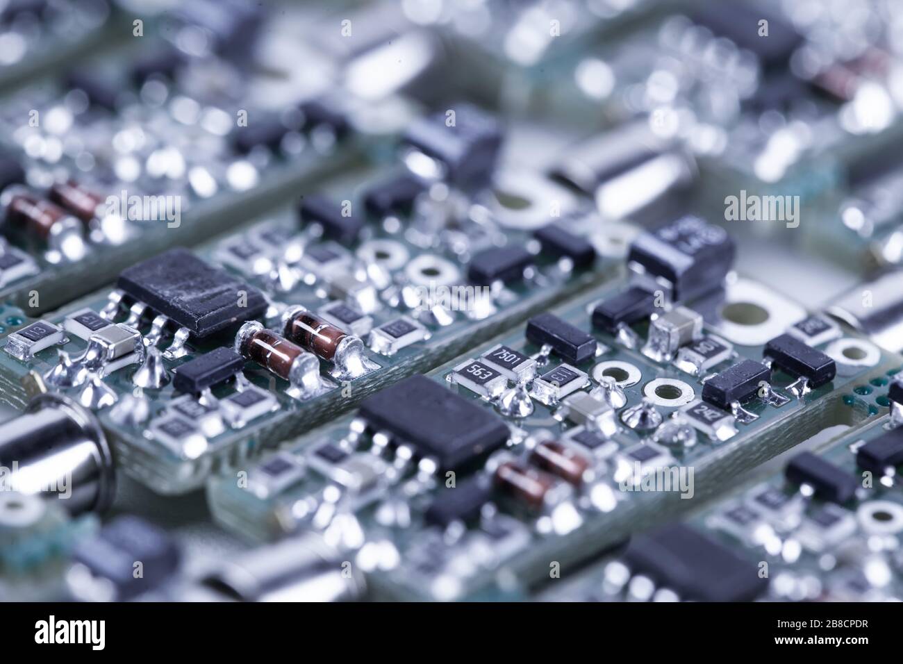 Close-up small microcircuits lie next to each other in the production ...