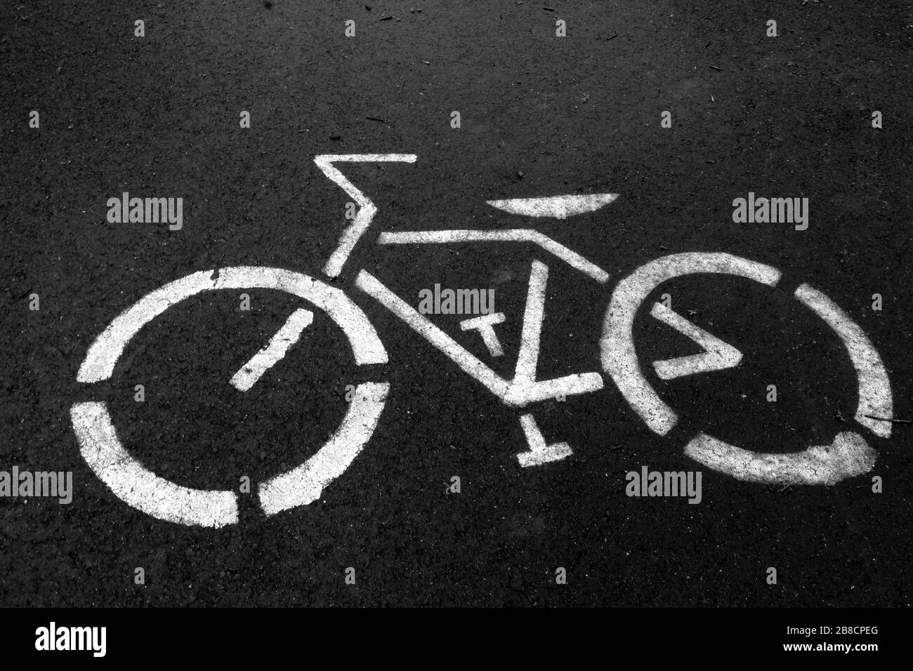 The picture of the bicycle points the way to the bike path Stock Photo