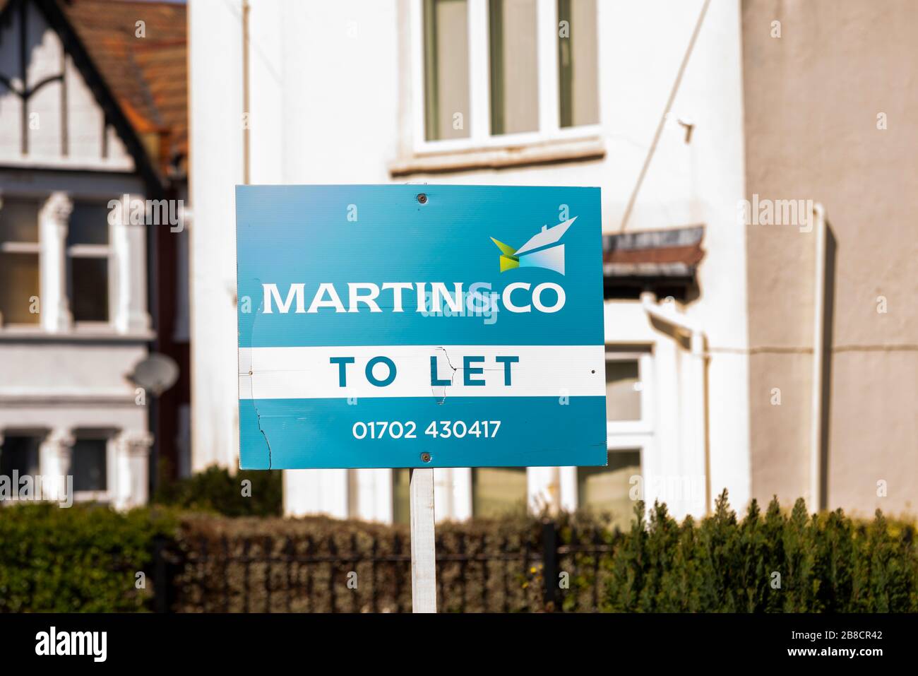 Martin & Co lettings and estate agents business sign board outside property home in Westcliff on Sea, Essex, UK. To Let sign. Estate agency Stock Photo