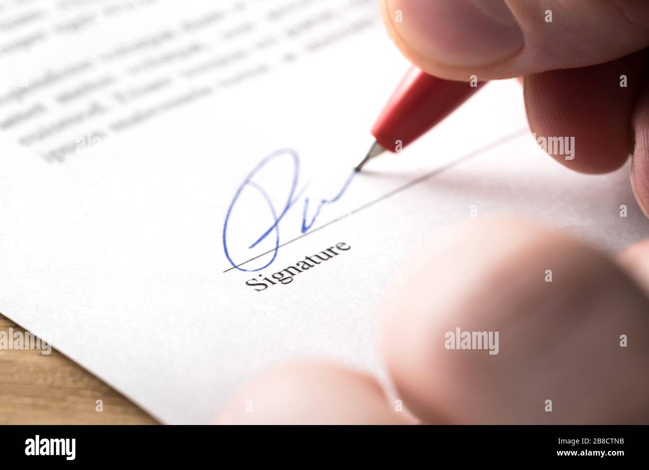 Signing contract, lease or settlement for acquisition, apartment lease, insurance, bank loan, mortgage or business buyout. Man writing name. Stock Photo