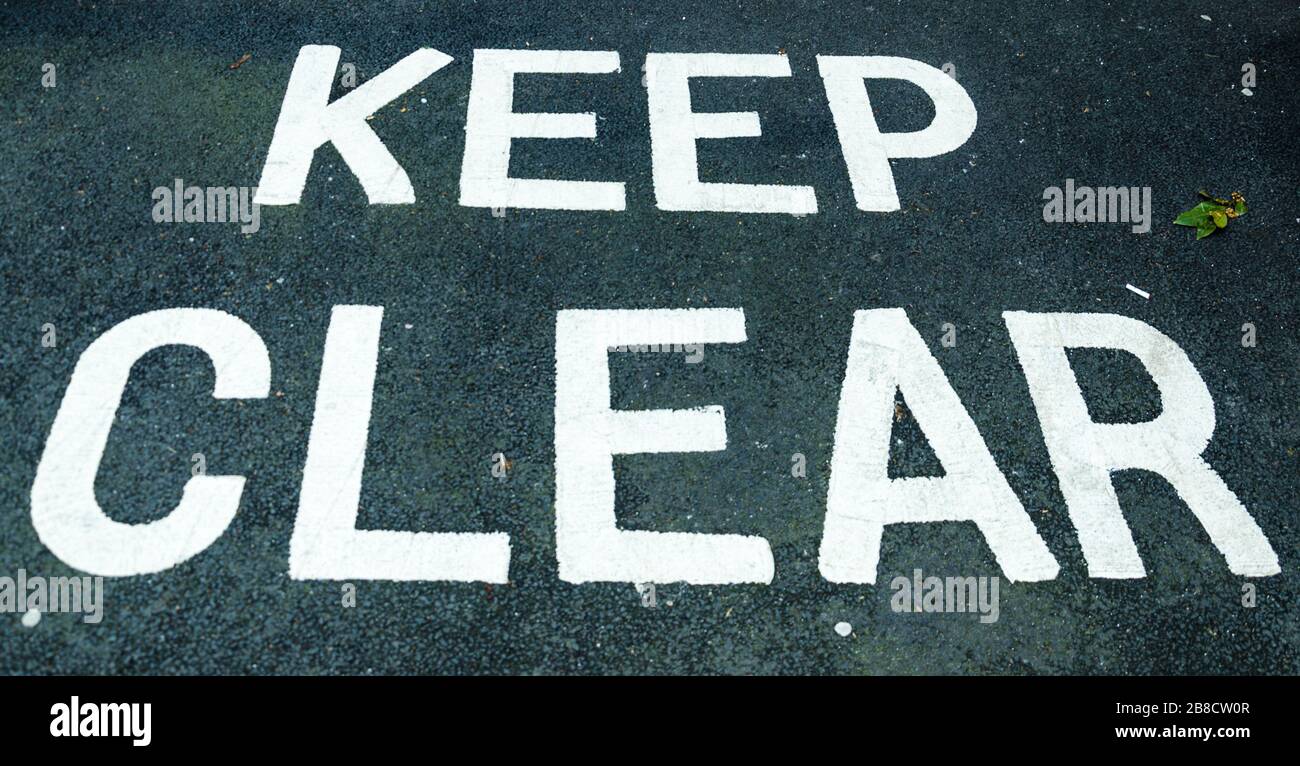 keep clear sign impressed on the road Stock Photo