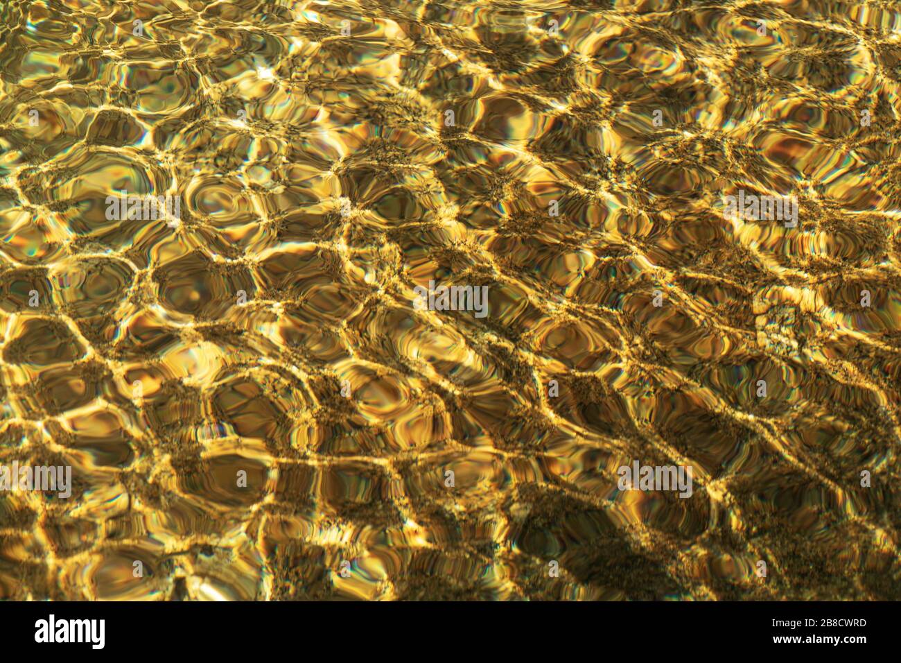 Water Gold Ripple Background river water rippled water detail background with gold color from stone ...