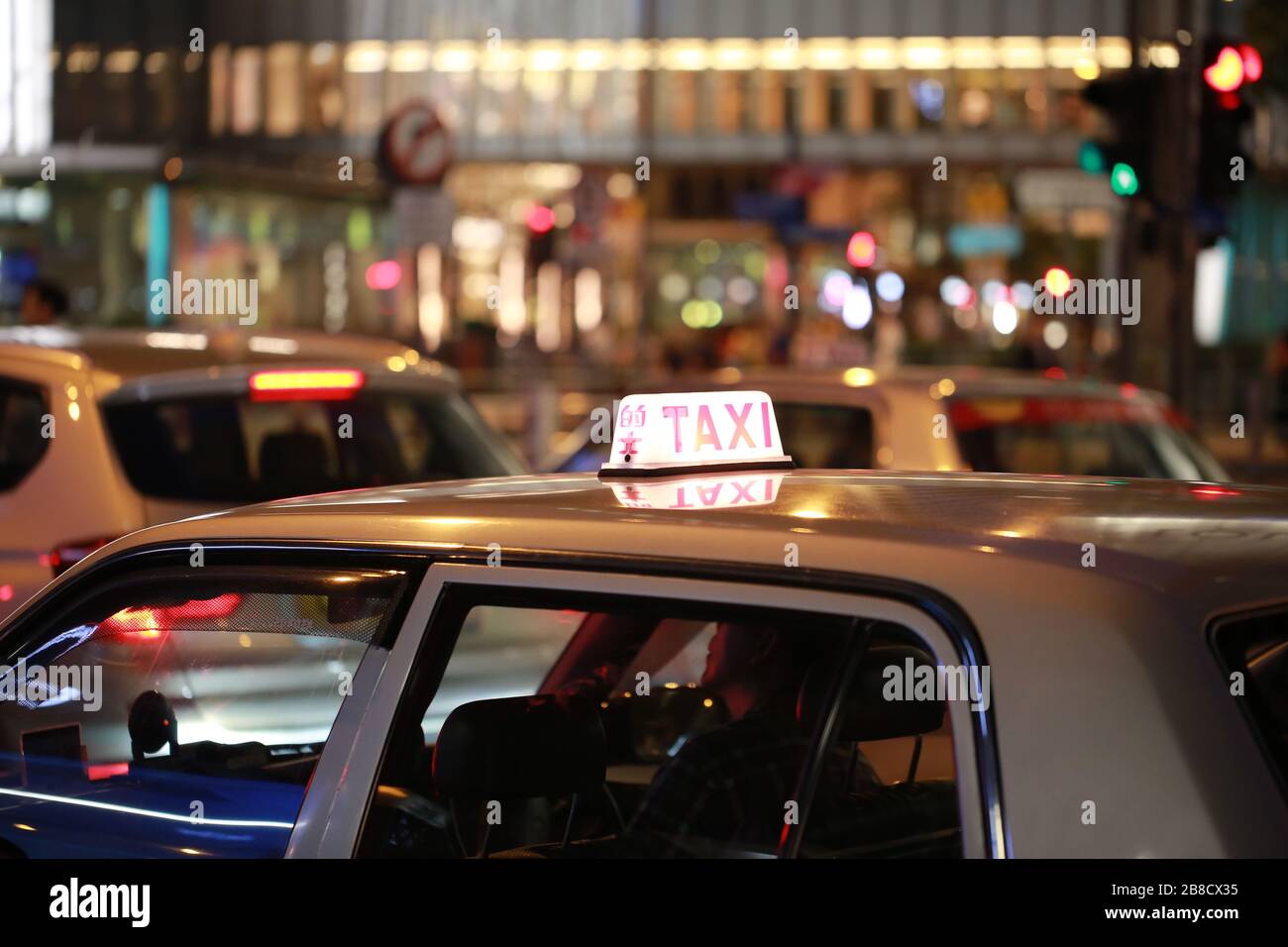 taxi and chinese word taxi on the cab light box in hong kong with the