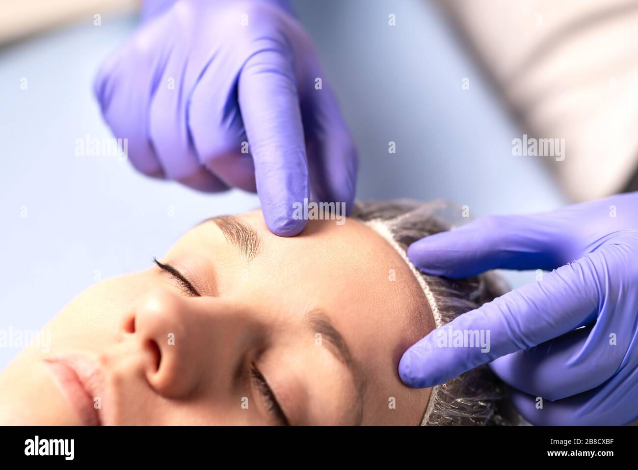 Cosmetologist, plastic surgeon or doctor with patient or customer. Consultation and plan before facial surgery in hospital, skin treatment or facelift. Stock Photo