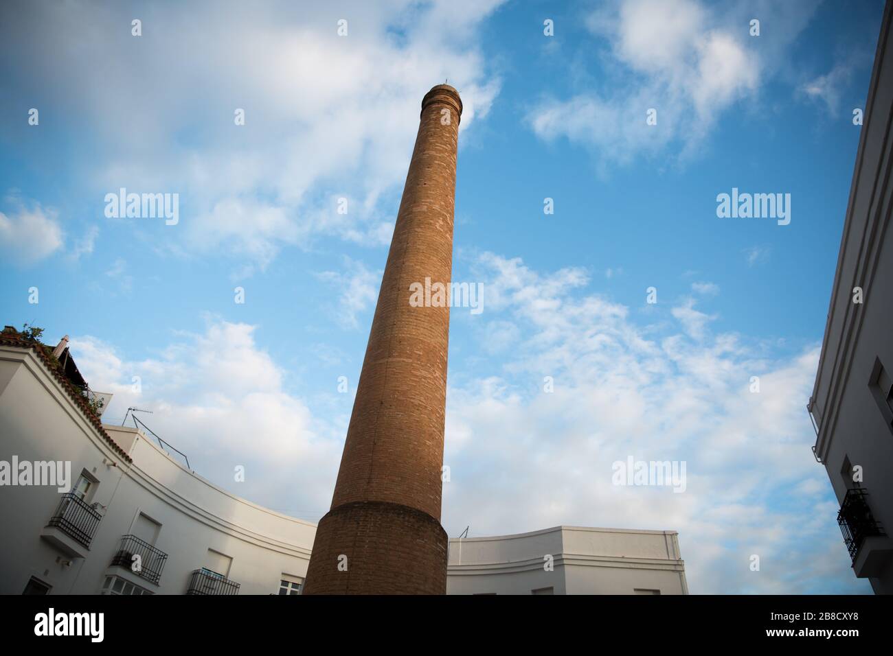 Old Factory Chimney made of Orange Bricks in Jerez de la Frontera, South of Spain Stock Photo