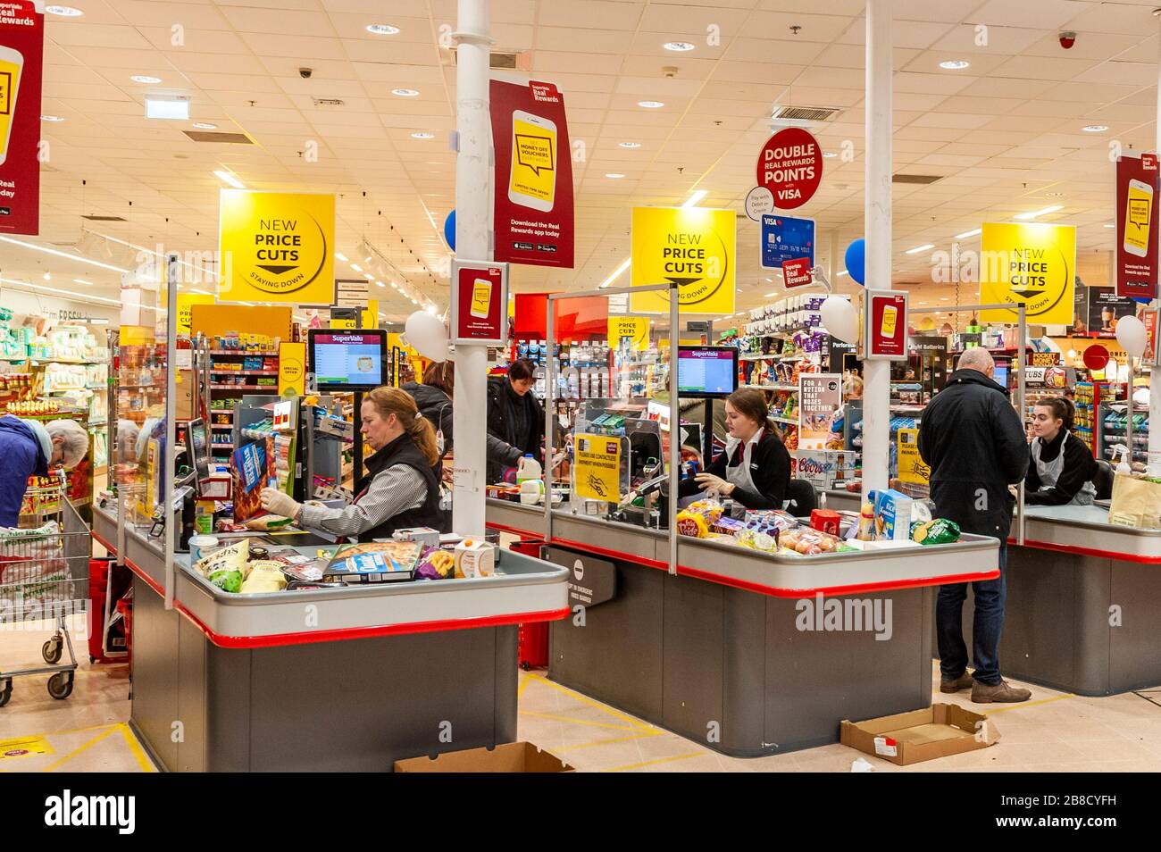 Bandon, West Cork, Ireland. 21st Mar, 2020. Supervalu has installed plastic protective screens at its checkouts to follow the government's social distancing guidelines due to the  COVID-19 virus.  The screens are designed to protect checkout staff, who have also been issued with disposable aprons. Credit: Andy Gibson/Alamy Live News Stock Photo