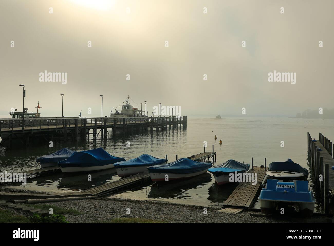 Foggy morning on landing stage n Gstadt Stock Photo